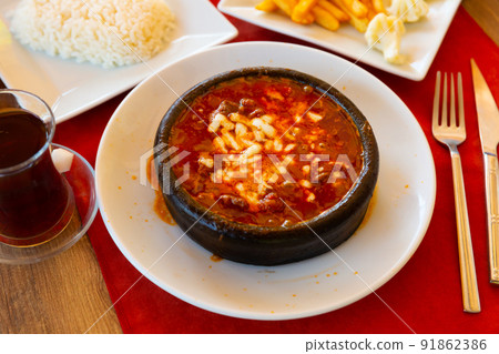Portion of just cooked Osmanli kebab Portion of just cooked Osmanli kebab 91862386