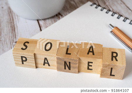 Image of solar panel | Block, notebook, pen, cup with "SOLAR PANEL" written on it 91864107