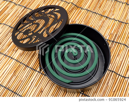 Mosquito coil set in a mosquito spear 91865924