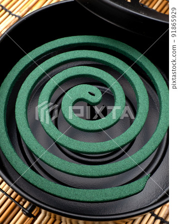 Mosquito coil set in a mosquito spear 91865929