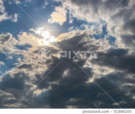 Dramatic blue sky with contrast of sunlight and clouds Dramatic blue sky with contrast of sunlight and clouds 91866205