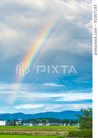 A beautiful rainbow in the sky after the rain A beautiful rainbow in the sky after the rain 91867197