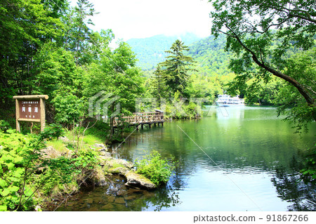 Lake Akan and a pleasure boat Lake Akan and a pleasure boat 91867266