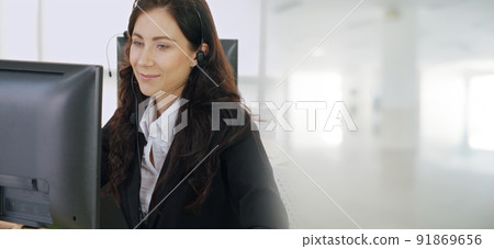 Business people wearing headset working in office broaden view Business people wearing headset working in office broaden view 91869656