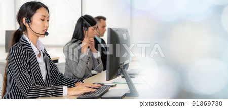 Business people wearing headset working in office broaden view 91869780