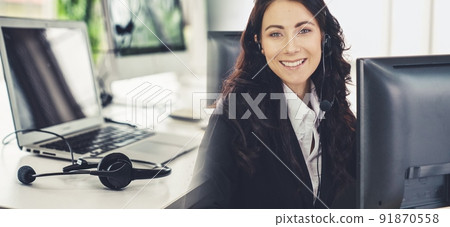 Business people wearing headset working in office broaden view Business people wearing headset working in office broaden view 91870558