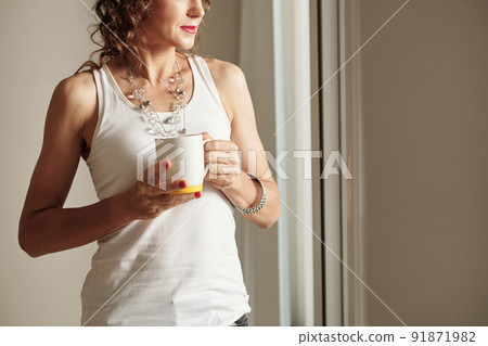 Pensive Woman Drinking Coffee Pensive Woman Drinking Coffee 91871982