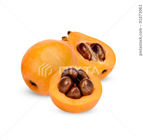 Half and whole ripe loquat fruits isolated on white background Half and whole ripe loquat fruits isolated on white background 91873061