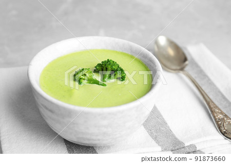 Delicious broccoli cream soup served on table Delicious broccoli cream soup served on table 91873660