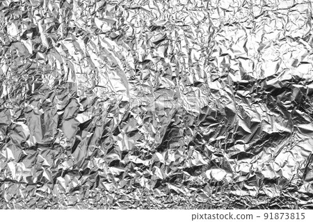 Crumpled silver foil as background, closeup view 91873815