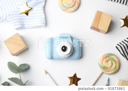 Composition with toy camera on white background, top view. Future photographer 91873861