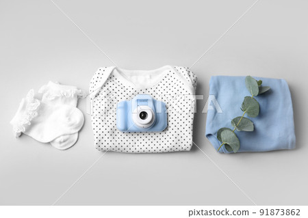 Flat lay composition with toy camera on light grey background. Future photographer 91873862