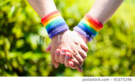 LGBT image of a male couple holding hands 91875296