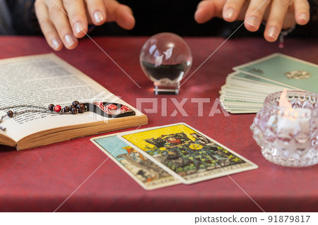 Fortune-teller doing tarot fortune-telling on a red cross 91879817