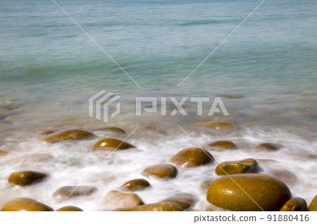 Waves on the beach seen in slow shot Waves on the beach seen in slow shot 91880416