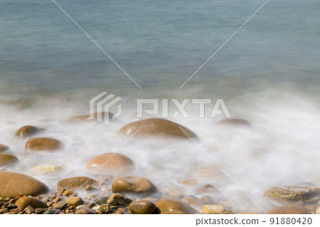 Waves on the beach seen in slow shot Waves on the beach seen in slow shot 91880420