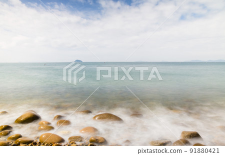 Waves on the beach seen in slow shot Waves on the beach seen in slow shot 91880421