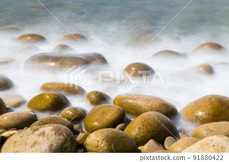 Waves on the beach seen in slow shot Waves on the beach seen in slow shot 91880422
