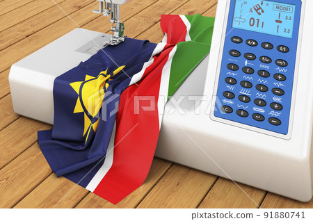 Sewing machine with Namibian flag on the wooden table. 3D rendering Sewing machine with Namibian flag on the wooden table. 3D rendering 91880741