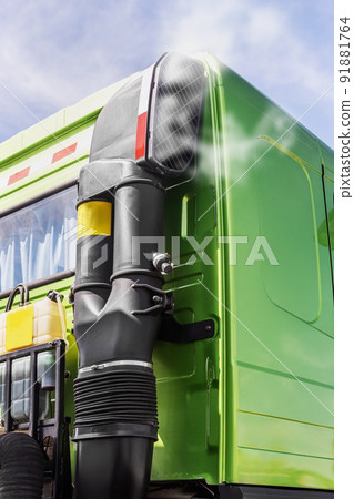 an air filter and a running truck engine against the background 91881764