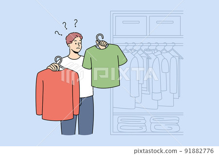 Man choose what to wear in wardrobe 91882776