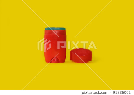 Male deodorant on a bright yellow background Male deodorant on a bright yellow background 91886001