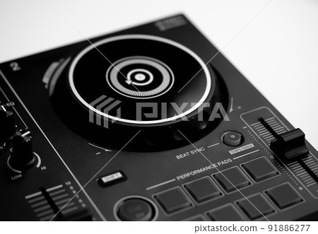 DJ mixing deck Controller connecting to Laptop and tablet using USB cable. DJ mixing deck Controller connecting to Laptop and tablet using USB cable. 91886277