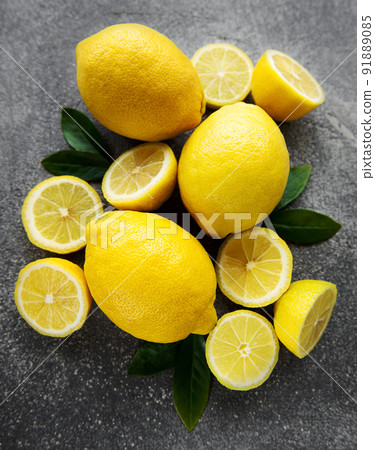 Fresh ripe lemons on dark background Fresh ripe lemons on dark background 91889085