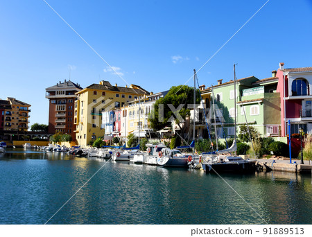 Jetty with yacht. Yachts and motor boats in marina Port Saplaya, Valencia.  91889513