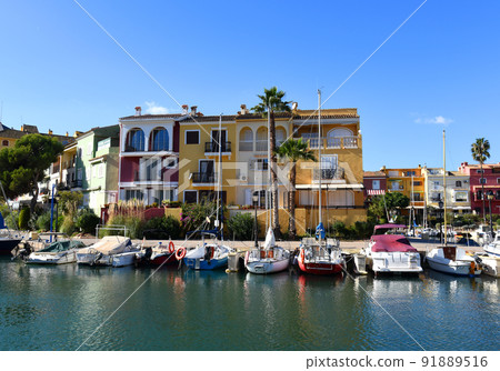 Jetty with yacht. Yachts and motor boats in marina Port Saplaya, Valencia.  91889516