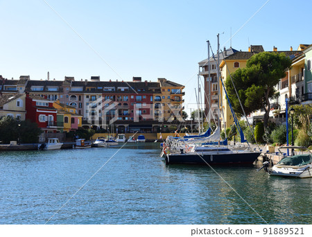 Jetty with yacht. Yachts and motor boats in marina Port Saplaya, Valencia.  91889521