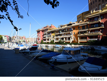 Jetty with yacht. Yachts and motor boats in marina Port Saplaya, Valencia. Jetty with yacht. Yachts and motor boats in marina Port Saplaya, Valencia. 91889523