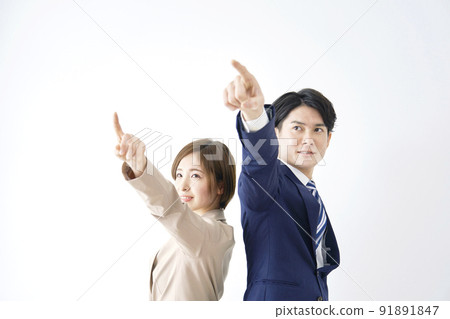 Business woman pointing up and businessman white background Business woman pointing up and businessman white background 91891847