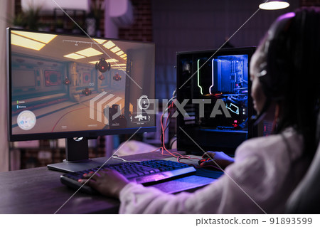 Modern person playing video games tournament on computer, attending online gaming championship with multiple players. Female action player streaming esport competition on internet. 91893599