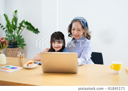 Asian portrait, grandchild granddaughter grandma grandmother and granddaughter happily join in activities to enhance skills for grandchildren. 91895171