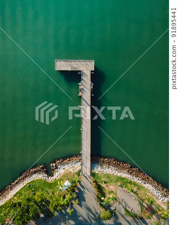 Top view of pier and sea with sunlight, aerial view 91895441