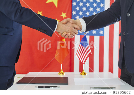 China and USA negotiators reach trade agreement, make deal and exchange handshakes 91895662