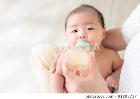 Baby drinking milk 1 month old copy space Baby drinking milk 1 month old copy space 91895717