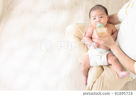 Baby drinking milk 1 month old copy space 91895728