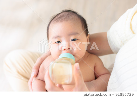 Baby drinking milk 1 month old copy space Baby drinking milk 1 month old copy space 91895729