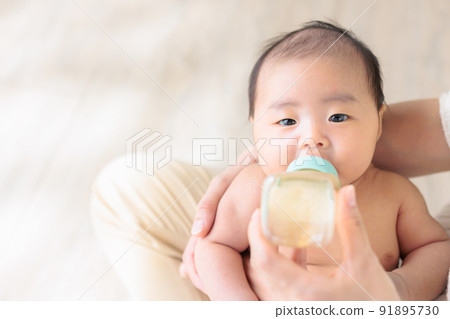 Baby drinking milk 1 month old copy space 91895730
