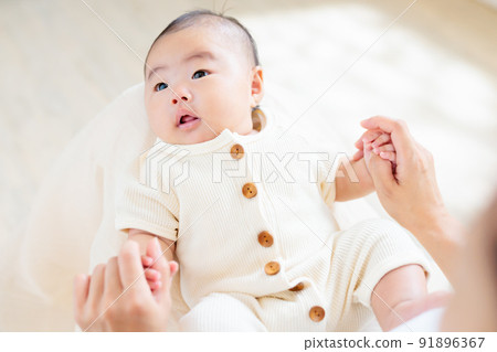 Contact on mom's lap 2 months old baby hand play Contact on mom's lap 2 months old baby hand play 91896367