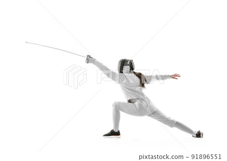 Dynamic portrait of female fencer in sports costume with rapier in hand training isolated on white background. Sport, youth, healthy lifestyle, achievements. 91896551