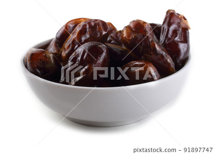 Date fruits on saucer isolated on white 91897747