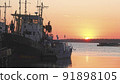 Old abandoned fishing boat at sunset 91898105