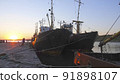 Old abandoned fishing boat at sunset 91898107