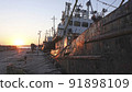 Old abandoned fishing boat at sunset 91898109