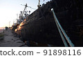 Old abandoned fishing boat at sunset 91898116