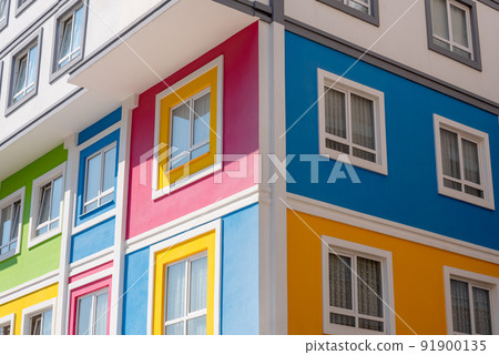 Fragment of the corner of a bright multi-colored building. Fragment of the corner of a bright multi-colored building. 91900135