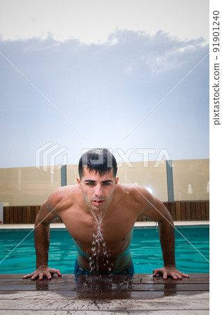 Sensual man in swimming pool 91901240